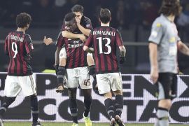 AC Milan's Mario Balotelli, second from left, celebrates with teammates after scoring during the Italian Cup first-leg, semifinal match between Alessandria and AC Milan, at the Turin Olympic stadium, Italy, Tuesday, Jan. 26, 2016. (Alessandro Di Marco/ANSA via AP)