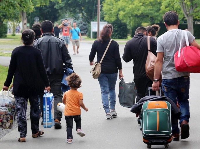 An Iraqi family arrives at the refugee transit camp in Friedland, Germany, 14 July 2015. The facility originally designed to accomodate 700 people is currently providing shelter to twice as many people, the director of the facility said.