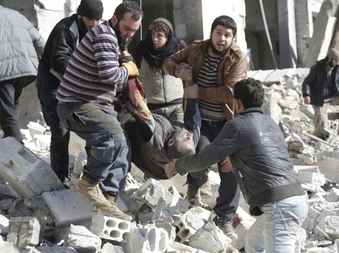 ATTENTION EDITORS - VISUAL COVERAGE OF SCENES OF DEATH AND INJURYResidents carry an injured man in a site hit by what activists said were airstrikes carried out by the Russian air force in the rebel-controlled area of Maaret al-Numan town in Idlib province, Syria January 9, 2016. At least 70 people died in what activists said where 4 vacuum bombs dropped by the Russian air force in the town of Maaret al-Numan; other air strikes were also carried out in the towns of Saraqib, Khan Sheikhoun and Maar Dabseh, in Idlib. REUTERS/Khalil Ashawi