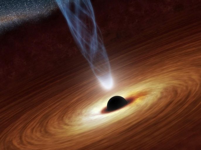 A supermassive black hole with millions to billions times the mass of our sun is seen in an undated NASA artist's concept illustration. In this illustration, the supermassive black hole at the center is surrounded by matter flowing onto the black hole in what is termed an accretion disk. This disk forms as the dust and gas in the galaxy falls onto the hole, attracted by its gravity. Also shown is an outflowing jet of energetic particles, believed to be powered by the black hole's spin, according to a NASA news release. REUTERS/NASA/JPL-Caltech/Handout THIS IMAGE HAS BEEN SUPPLIED BY A THIRD PARTY. IT IS DISTRIBUTED, EXACTLY AS RECEIVED BY REUTERS, AS A SERVICE TO CLIENTS. FOR EDITORIAL USE ONLY. NOT FOR SALE FOR MARKETING OR ADVERTISING CAMPAIGNS