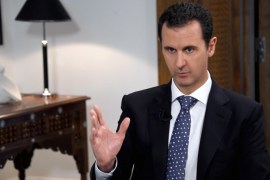 In this photo released by the Syrian official news agency SANA, shows Syrian President Bashar Assad, speaks during an interview with the Spanish news agency EFE, in Damascus, Syria, Friday, Dec. 11, 2015. Assad said in the interview that Saudi Arabia, the United States and some Western countries want "terrorist groups" to join peace negotiations to try end Syria's civil war. The Syrian government refers to all insurgent groups as terrorists. (SANA via AP)