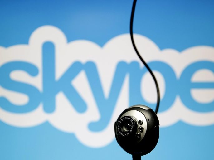 A web camera is seen in front of a Skype logo in this photo illustration taken in Zenica, May 26, 2015. Online communication service Skype has been summoned to appear in court in Belgium after refusing to pass on customer data to aid a criminal investigation, a court spokesman said. A court in Mechelen, just north of Brussels, had asked for data from messages and calls exchanged on Microsoft-owned Skype, arguing that telecom operators in the country were required to do so. REUTERS/Dado Ruvic