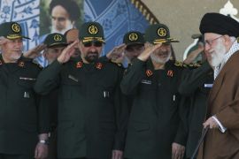In this picture released by an official website of the office of the Iranian supreme leader on Wednesday, May 20, 2015, Supreme Leader Ayatollah Ali Khamenei, right, arrives at a graduation ceremony of the Revolutionary Guard's officers, while deputy commander of the Revolutionary Guard, Hossein Salami, second right, former commanders of the Revolutionary Guard Mohsen Rezaei, second left, and Yahya Rahim Safavi salute him in Tehran, Iran. Iran's supreme leader vowed Wednesday he will not allow international inspection of Iran's military sites or access to Iranian scientists under any nuclear agreement with world powers. (Office of the Iranian Supreme Leader via AP)