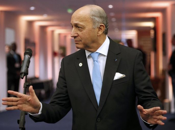 French Foreign Minister Laurent Fabius, President-designate of COP21, reacts after a press conference during the World Climate Change Conference 2015 (COP21) at Le Bourget, near Paris, France, December 11, 2015. Fabius said on Friday he was confident a global accord to combat climate change could be adopted after a final draft will be released on Saturday morning. REUTERS/Stephane Mahe