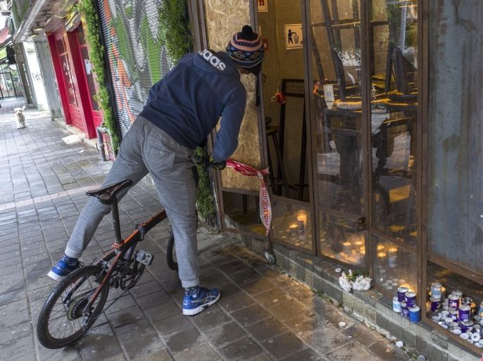 An Israeli man stops to look inside the cafe in central, Tel Aviv, Israel, 02 January 2016, where an Israeli-Arab man opened fire with an automatic weapon killing two people on 01 January 2016. A man hunt is still underway for the 29-year old suspect who escaped after spraying the cafe with automatic fire. Israeli police widened a manhunt for an Arab-Israeli gunman focusing their searches on greater Tel Aviv and surrounding areas, Israel Radio reported.