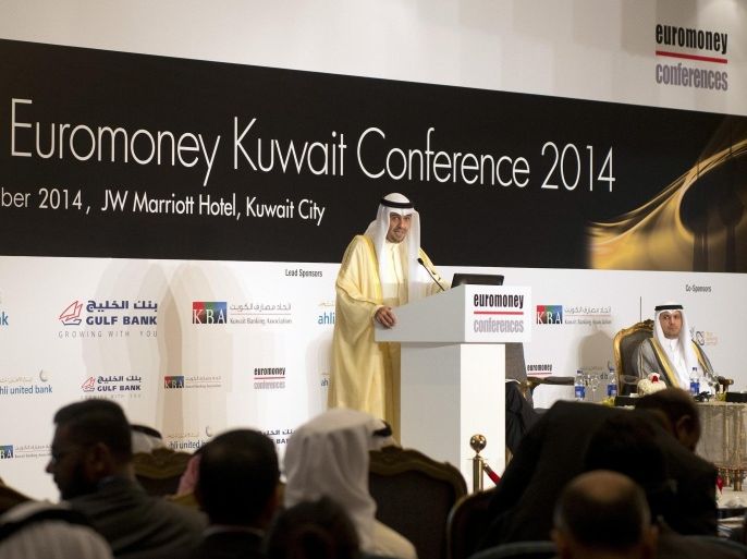 Kuwait's Minister of Finance Anas al-Saleh speaks at the opening of the Euromoney Conference in Kuwait City September 9, 2014. Kuwait is suspending a programme under which foreign winners of big government contracts are required to invest in the local economy, Saleh said on Tuesday, as it tries to attract more overseas companies to the Gulf state. REUTERS/Stephanie McGehee (KUWAIT - Tags: BUSINESS POLITICS)