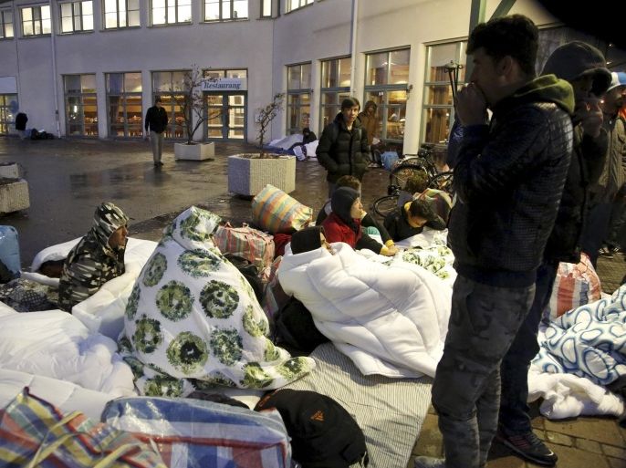 File photo of refugees outside an entrance of the Swedish Migration Agency's arrival center for asylum seekers at Jagersro in Malmo, Sweden, November 20, 2015. To match EUROPE-MIGRANTS/SWEDEN REUTERS/Stig-Ake Jonsson/TT News Agency ATTENTION EDITORS - THIS IMAGE WAS PROVIDED BY A THIRD PARTY. FOR EDITORIAL USE ONLY. NOT FOR SALE FOR MARKETING OR ADVERTISING CAMPAIGNS. THIS PICTURE IS DISTRIBUTED EXACTLY AS RECEIVED BY REUTERS, AS A SERVICE TO CLIENTS. SWEDEN OUT. NO COMMERCIAL OR EDITORIAL SALES IN SWEDEN. NO COMMERCIAL SALES.