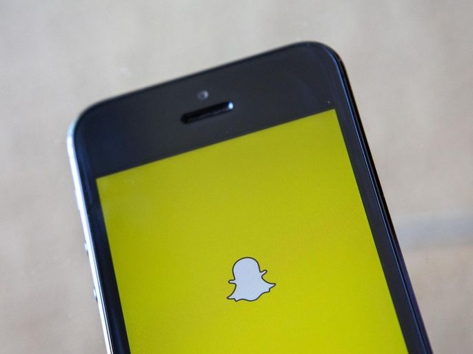 The logo of the Snapchat app is shown on a mobile phone in Ventura, California in this December 21, 2013 file photo. Alibaba is investing $200 million in photo-messaging app Snapchat, according to a source familiar with the deal said March 12, 2015 , striking its latest Silicon Valley deal as the Chinese ecommerce company builds up mobile services. REUTERS/Eric Thayer/Files (UNITED STATES - Tags: BUSINESS LOGO)