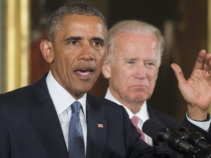 US President Barack Obama (L) delivers remarks with tears in his eyes at an event held to announce executive actions to reduce gun violence, beside US Vice President Joe Biden (R), in the East Room of the White House in Washington, DC, USA, 05 January 2016. Obama outlined measures such as strengthening background checks for purchasing guns and requiring individuals that sell firearms to register as licensed gun dealers.