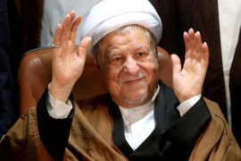 Former Iranian President Akbar Hashemi Rafsanjani, who is also a member of the Experts Assembly, waves to media as he registers his candidacy for the Feb. 26 elections of the assembly at interior ministry in Tehran, Iran, Monday, Dec. 21, 2015. (AP Photo/Ebrahim Noroozi)