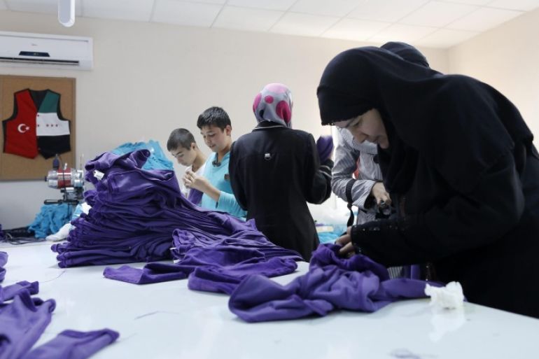 Syrian refugee women and children work in a textile store at Harran Refugee Camp in Sanliurfa, southeast of Turkey, 23 September 2015. Europe is experiencing its most significant influx of migrants and refugees since World War II, with many people fleeing war-torn nations and qualifying for international protection. EU leaders announced plans to redirect 1.7 billion euros (1.9 billion dollars) from the EU budget towards tackling the migration crisis. This includes reallocating as much as 1 billion euros to help Turkey cope with the refugees it has taken in, as well as increasing funding for the World Food Programme, which distributes food in refugee camps near Syria.