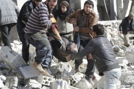 ATTENTION EDITORS - VISUAL COVERAGE OF SCENES OF DEATH AND INJURYResidents carry an injured man in a site hit by what activists said were airstrikes carried out by the Russian air force in the rebel-controlled area of Maaret al-Numan town in Idlib province, Syria January 9, 2016. At least 70 people died in what activists said where 4 vacuum bombs dropped by the Russian air force in the town of Maaret al-Numan; other air strikes were also carried out in the towns of Saraqib, Khan Sheikhoun and Maar Dabseh, in Idlib. REUTERS/Khalil Ashawi