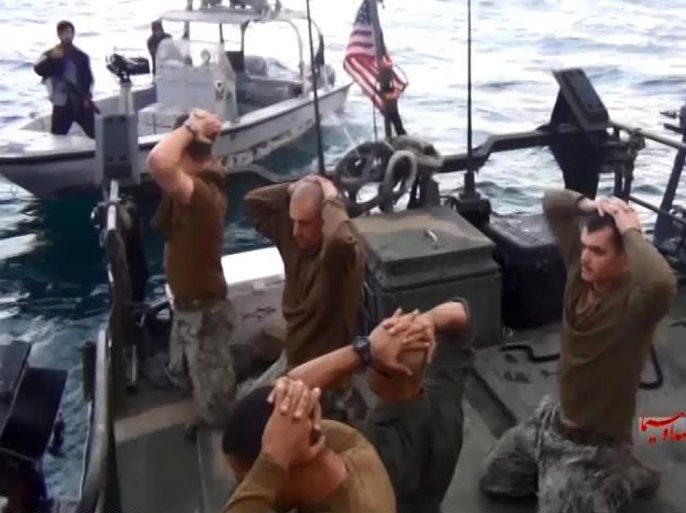 This frame grab from Tuesday, January 12, 2016 video by the Iranian state-run IRIB News Agency, shows detention of American Navy sailors by the Iranian Revolutionary Guards in the Persian Gulf, Iran. The 10 U.S. Navy sailors detained by Iran after their two small boats allegedly drifted into Iranian territorial waters around one of Iran's Persian Gulf islands a day earlier have been freed, the United States and Iran said Wednesday. (IRIB News Agency via AP)