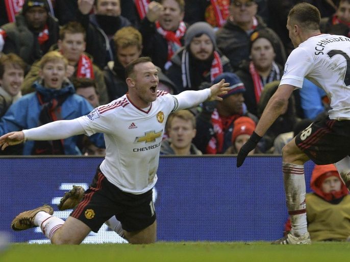 17584 - Liverpool, Merseyside, UNITED KINGDOM : Manchester United's English striker Wayne Rooney (L) celebrates scoring the opening goal during the English Premier League football match between Liverpool and Manchester United at Anfield in Liverpool, northwest England, on January 17, 2016. AFP PHOTO / PAUL ELLIS