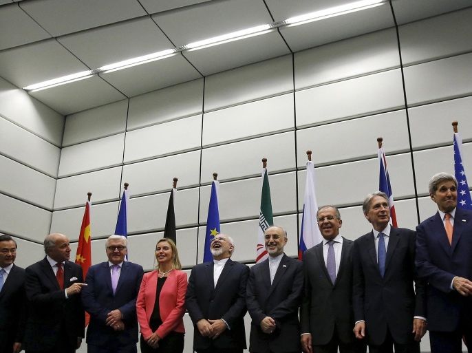 (From L to R) Chinese Foreign Minister Wang Yi, French Foreign Minister Laurent Fabius, German Foreign Minister Frank Walter Steinmeier, European Union High Representative for Foreign Affairs and Security Policy Federica Mogherini, Iranian Foreign Minister Mohammad Javad Zarif, Head of the Iranian Atomic Energy Organization Ali Akbar Salehi, Russian Foreign Minister Sergey Lavrov, British Foreign Secretary Philip Hammond and U.S. Secretary of State John Kerry pose for a group picture at the United Nations building in Vienna, Austria in this file picture taken July 14, 2015. Iran and six major world powers reached a nuclear deal on Tuesday, capping more than a decade of on-off negotiations with an agreement that could potentially transform the Middle East, and which Israel called an "historic surrender". REUTERS/Carlos Barria/Files