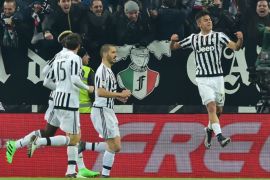 CAC3057 - Turin, -, ITALY : Juventus' forward from Argentina Paulo Dybala (R) celebrates after scoring during the Italian Serie A football match Juventus vs AS Roma at "Juventus Stadium" in Turin on January 24, 2016. AFP PHOTO / GIUSEPPE CACACE