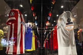(FILE) A file picture dated 06 May 2014 of the jerseys of Spanish soccer clubs Atletico Madrid (L) and Real Madrid (R) on display at the UEFA Champions League Gallery at Lisbon City Hall in Lisbon, Portugal. Real Madrid and Atletico Madrid have been given FIFA transfer bans for breaches relating to the international transfer and registration of players under the age of 18, the world governing body said on 14 January 2016. EPA/MARIO CRUZ *** Local Caption *** 51353638