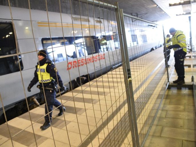 Police mounts a temporary fence to ease border control preventing illegal migrants to enter Sweden, between domestic and international tracks at Hyllie train station in southern Malmo, Sweden, 03 January 2016. The station is the first stop after crossing the Oresund Bridge from Denmark. Swedish authorities on 04 January will introduce identity checks for bus and train passengers entering Sweden. EPA/JOHAN NILSSON SWEDEN OUT