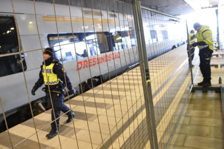 Police mounts a temporary fence to ease border control preventing illegal migrants to enter Sweden, between domestic and international tracks at Hyllie train station in southern Malmo, Sweden, 03 January 2016. The station is the first stop after crossing the Oresund Bridge from Denmark. Swedish authorities on 04 January will introduce identity checks for bus and train passengers entering Sweden. EPA/JOHAN NILSSON SWEDEN OUT