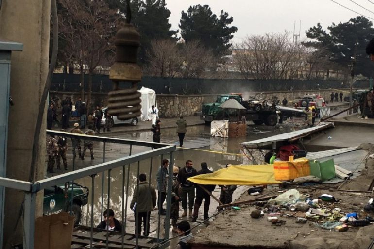 Afghan security officials inspect the scene of a suicide bomb attack at police checkpoint near Kabul International Airport in Kabul, Afghanistan, 04 January 2016. A suicide bomber detonated his explosives at a police checkpoint near Kabul airport, officials said. There were no immediate reports of casualties or injuries. General Ahmad Farid Afzali, head of the Kabul police criminal investigation unit, said that the bomber blew up his explosives inside a vehicle near the checkpoint.