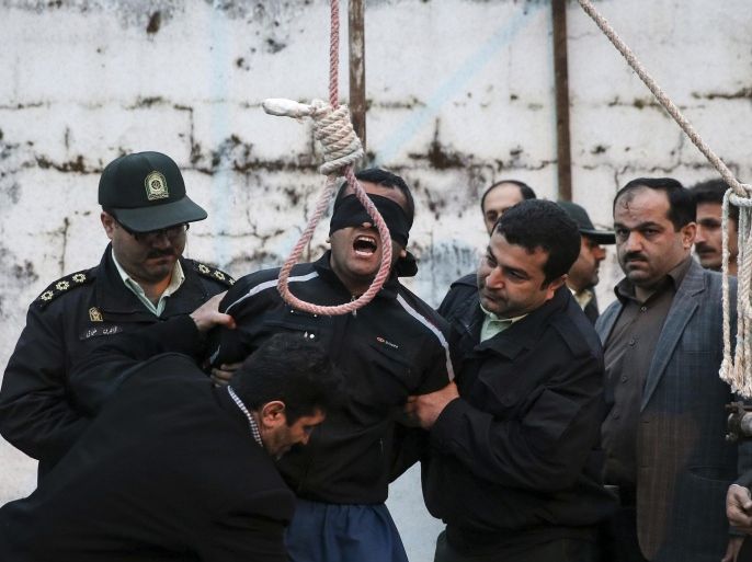 FILE - This Tuesday, April 15, 2014 file photo, provided by ISNA, a semi-official news agency, shows a blindfolded Iranian man Bilal being prepared to be hanged in public in the northern city of Nour, Iran. Bilal, who was convicted of killing Abdollah Hosseinzadeh, was pardoned by the victim's family moments before being executed. His mother, Samerah Alinejad tells The Associated Press that she had felt she could never live with herself if the man who killed her son were spared. But in the last moment, she pardoned him in an act that has made her a hero in her hometown, where banners in the streets praise her family’s mercy. (AP Photo/ISNA, Arash Khamoushi, File)