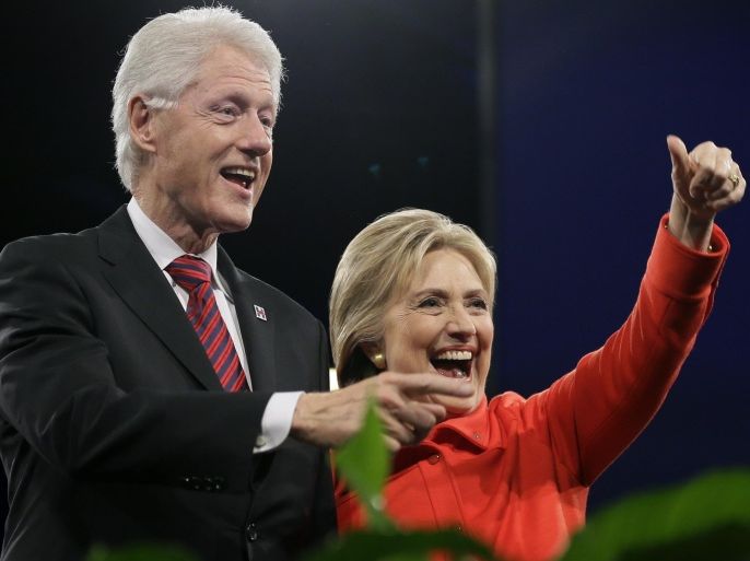 FILE - In this Oct. 24, 2015 file photo, former President Bill Clinton and his wife, Democratic presidential candidate Hillary Rodham Clinton, wave to supporters after the Iowa Democratic Party's Jefferson-Jackson fundraising dinner in Des Moines, Iowa. Hillary Rodham Clinton's presidential campaign has scheduled more than a dozen December events featuring the former president as her team prepares for an end-of-year finance deadline ahead of the first contests in Iowa and New Hampshire. (AP Photo/Charlie Neibergall)