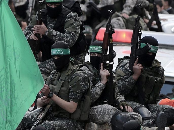 Palestinian fighters of the Izz Al-Din al-Qassam brigades, the military wing of Palestinian Hamas organization, attend the funeral of seven bodies of Al-Qassam fighters during their funeral in the east of Gaza City on, 29 January 2016. Seven fighters ofrom Al-Qassam were killed after a tunnel built for fighting Israel collapsed in the Gaza Strip.