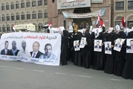 Women hold a banner and posters of activists, whom they say are being held by Houthi fighters, during an anti-Houthi demonstration in Sanaa March 4, 2015. Violence has spread and intensified in Yemen since the Iranian-backed Houthis captured the capital Sanaa on Sept. 21 and fanned out south and east seizing traditional Sunni areas. Yemen plunged deeper into political turmoil in January after the Houthis seized the presidential palace and forced the Western-backed President Abd-Rabbu Mansour Hadi and his government to resign. The banner (L) reads: "Freedom for the freedom seekers held hostage by the Houthi militia." REUTERS/Khaled Abdullah (YEMEN - Tags: POLITICS CIVIL UNREST CONFLICT)