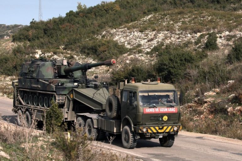 A Turkish army truck loaded with a self-propelled gun heading to the Syrian border near Yayladagi, Turkey, Wednesday, Nov. 25, 2015. Prime Minister Ahmet Davutoglu is seeking to reduce tensions with Moscow, saying that Russia is Turkey’s “friend and neighbor” and insisting relations cannot be “sacrificed to accidents of communication.” Davutoglu told his party’s lawmakers on Wednesday that Turkey didn’t know the nationality of the plane that was brought down at the border with Syria on Tuesday until Moscow announced it was Russian.(AP Photo)