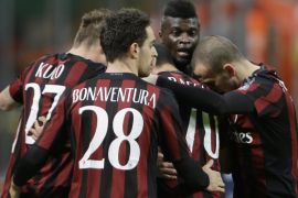 AC Milan's Mbaye Niang, second from right, celebrates with teammates after scoring during the Italian Cup soccer match between AC Milan and Carpi at the San Siro stadium in Milan, Italy, Wednesday, Jan. 13, 2016. (AP Photo/Antonio Calanni)