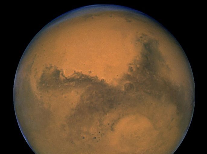 The planet Mars is seen in an image from NASA's Hubble Space Telescope taken August 27, 2003. Scientists have found the first evidence that briny water may flow on the surface of Mars during the planet's summer months, a paper published on Monday showed. REUTERS/NASA/Handout via Reuters THIS IMAGE HAS BEEN SUPPLIED BY A THIRD PARTY. IT IS DISTRIBUTED, EXACTLY AS RECEIVED BY REUTERS, AS A SERVICE TO CLIENTS. FOR EDITORIAL USE ONLY. NOT FOR SALE FOR MARKETING OR ADVERTISING CAMPAIGNS