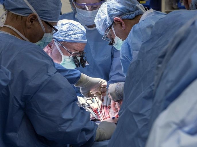 In this Wednesday, Feb. 24, 2016, photo provided by Cleveland Clinic Center, a team of Cleveland Clinic transplant surgeons and gynecological surgeons perform the nation’s first uterus transplant during a nine-hour surgery in Cleveland. In a statement Thursday, the Cleveland Clinic said the surgery was performed on a 26-year-old woman, using a uterus from a deceased donor. (Cleveland Clinic Center via AP)