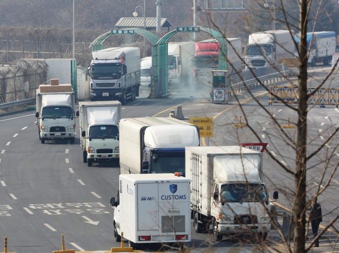 Vehicles pass through an inter-Korean immigration office in South Korea's western border city of Paju, South Korea, 11 February 2016, a day after Seoul announced it will shut down the complex in retaliation for the North's series of provocations. South Korean companies operating in the complex are expected to bring back equipment and materials in phases. The Kaesong Industrial Complex opened in 2004 in the North Korean border city of the same name and has been the last remaining inter-Korean cooperation project. The North conducted its fourth nuclear test on 06 January and launched a long-range rocket on 07 February.