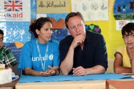 FILE - In this Monday, Sept. 14, 2015, file photo, British Prime Minister David Cameron meets refugee children and teenagers at the UNICEF Makani Centre at the Zaatari refugee camp in Jordan. International aid to the victims of Syria's five-year-old war, including millions forced to flee their homes, has persistently fallen short, but organizers of the Thursday, Feb. 4, 2016, annual Syria pledging conference hope for greater donor generosity this time around, despite a record ask of close to $9 billion for 2016. (Stefan Rousseau/Pool via AP, File)
