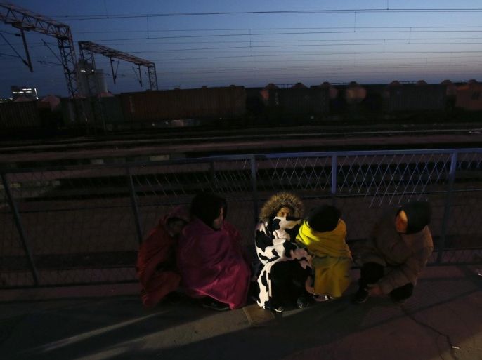 Migrants rest at the train station in Sid, about 100 km west from Belgrade, Serbia, Wednesday, Feb. 17, 2016. More than 200 people have been camping at a border train station after they were sent back to Serbia from Croatia amid tightened rules for migrants seeking entry into the European Union. (AP Photo/Darko Vojinovic)