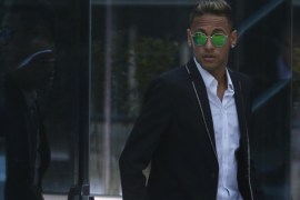 FC Barcelona's Neymar leaves the national court after testifying in an investigation into alleged irregularities regarding his transfer to Barcelona, in Madrid, Tuesday, Feb. 2, 2016. The court is looking into a complaint made by a Brazilian investment group which claims it was financially harmed when Barcelona and Neymar allegedly withheld the real amount of the player's transfer fee from Brazilian club Santos in 2013. (AP Photo/Francisco Seco)