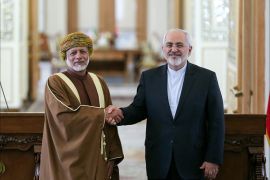 وزير الخارجية العماني يوسف بن علوي مع نظيره الإيراني جواد ظريف