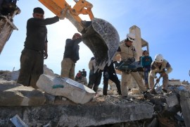 People and Civil Defense members remove rubble while looking for survivors in the ruins of a destroyed Medecins Sans Frontieres (MSF) supported hospital hit by missiles in Marat Numan, Idlib province, Syria, February 16, 2016. REUTERS/Ammar Abdullah