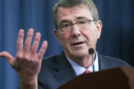 Defense Secretary Ash Carter gestures during a news conference at the Pentagon, Thursday, Jan. 28, 2016. Carter said Iran's videotaping of American sailors surrendering aboard their boats in the Persian Gulf earlier this month made him deeply angry. (AP Photo/Cliff Owen)