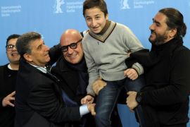 Giuseppe Fragapane, Pietro Bartolo, director Gianfranco Rosi, Samuele Pucillo and Giuseppe del Volgo (L-R) pose during a photocall to promote the movie 'Fuocoammare' (Fire at Sea) at the 66th Berlinale International Film Festival in Berlin, Germany February 13, 2016. REUTERS/Stefanie Loos