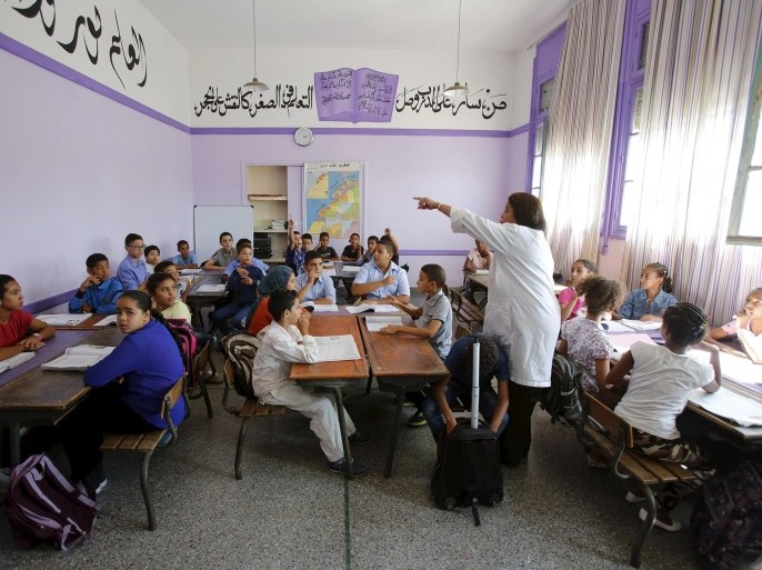 Schoolchildren listen to a teacher as they study during a class in the Oudaya primary school in Rabat, September 15, 2015, at the start of the new school year in Morocco. Nearly three years after Taliban gunmen shot Pakistani schoolgirl Malala Yousafzai, the teenage activist last week urged world leaders gathered in New York to help millions more children go to school. World Teachers' Day falls on 5 October, a Unesco initiative highlighting the work of educators struggling to teach children amid intimidation in Pakistan, conflict in Syria or poverty in Vietnam. Even so, there have been some improvements: the number of children not attending primary school has plummeted to an estimated 57 million worldwide in 2015, the U.N. says, down from 100 million 15 years ago. Reuters photographers have documented learning around the world, from well-resourced schools to pupils crammed into corridors in the Philippines, on boats in Brazil or in crowded classrooms in Burundi. REUTERS/Youssef BoudlalPICTURE 40 OF 47 FOR WIDER IMAGE STORY "SCHOOLS AROUND THE WORLD"SEARCH "EDUCATORS SCHOOLS" FOR ALL IMAGES