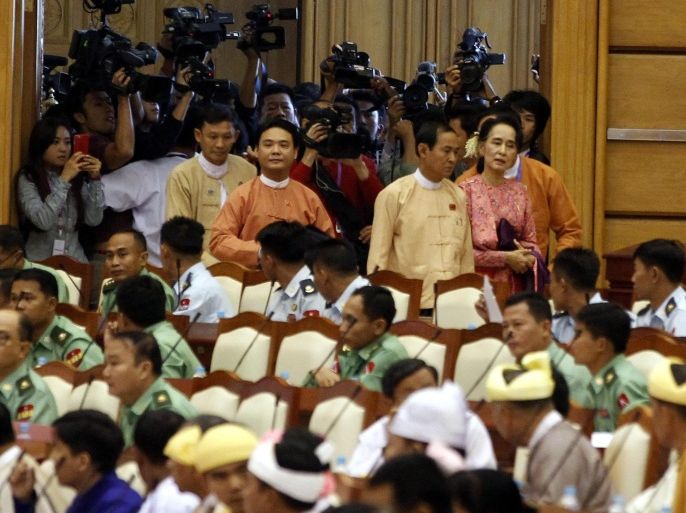 Myanmar democracy leader Aung San Suu Kyi (R, back) arrives for the first day of a new parliament session in Naypyitaw, Myanmar, 01 February 2016. Hundreds of newly-elected lawmakers were set to take their place in Myanmar's parliament on 01 February, after gaining seats in historic elections last year won by the National League for Democracy (NLD). NLD legislators, led by longtime pro-democracy activist Aung San Suu Kyi, will have a large majority in the new parliament after the party won a landslide in the November polls. The previous parliament was dominated by army-backed candidates, in a country that had spent nearly five decades under military dictatorship.