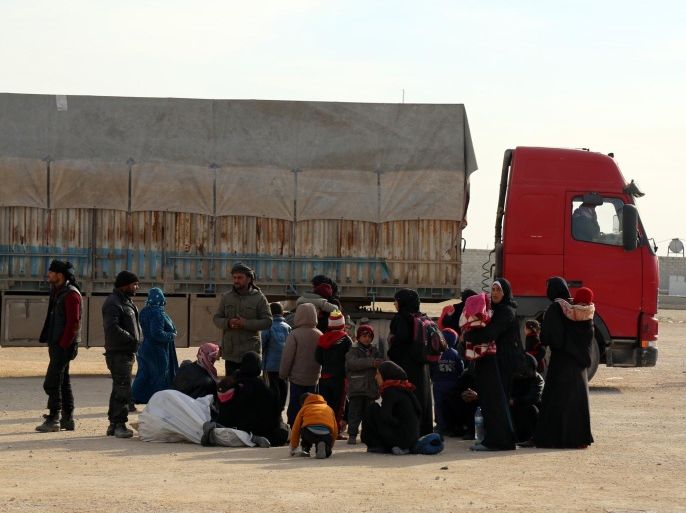 In this photo provided by Turkey's Islamic aid group of IHH, Syrians fleeing the conflicts in Azaz region, wait at the Bab al-Salam border gate, Syria, Friday, Feb. 5, 2016. Turkish officials say thousands of Syrians have massed on the Syrian side of the border seeking refuge in Turkey. Officials at the government’s crisis management agency said Friday it was not clear when Turkey would open the border to allow the group in and start processing them. The refugees who fled bombing in Aleppo, were waiting at the Bab al-Salam crossing, opposite the Turkish province of Kilis.(IHH via AP)