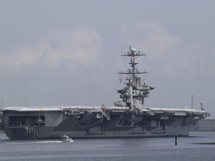 USS George Washington leaves the U.S. Navy's Yokosuka base in Yokosuka, near Tokyo Monday, May 18, 2015. The U.S. Navy's Japan-based aircraft carrier is heading home after seven years, to be replaced by a newer version of the same ship in the fall. (AP Photo/Koji Sasahara)