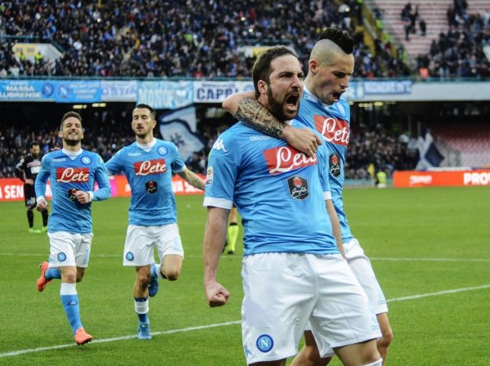 Napoli's Gonzalo Higuain, left, celebrates with teammate Marek Hamsik after scoring during a Serie A soccer match between Napoli and Carpi, at the San Paolo stadium in Naples, Italy, Sunday, Feb. 7, 2016. (AP Photo/Salvatore Laporta)