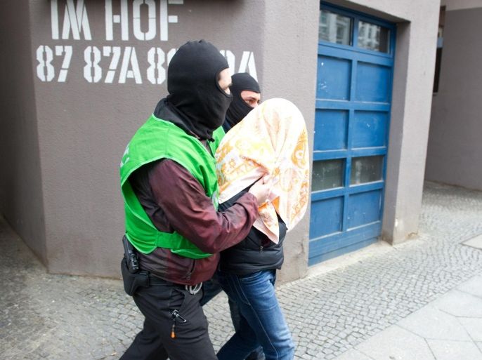 Members of the German police walk a suspect during a raid against alleged Islamists in Berlin, Germany, 04 February 2016. Two suspected Islamists were arrested in a series of coordinated raids across Germany prompted by a tip-off of a terrorist attack, security sources said. The raids were conducted in Berlin, Hanover and the town of Attendorn in North Rhine-Westphalia, and two out of four Algerian suspects wanted by police are now in custody. One man was apprehended in a refugee registration centre in Attendorn, while the other was taken into custody in the German capital, police said. The remaining two suspects have yet to be apprehended. Police received a tip-off of a terrorist attack from Germany's domestic intelligence agency. The location of the planned attack is not known.