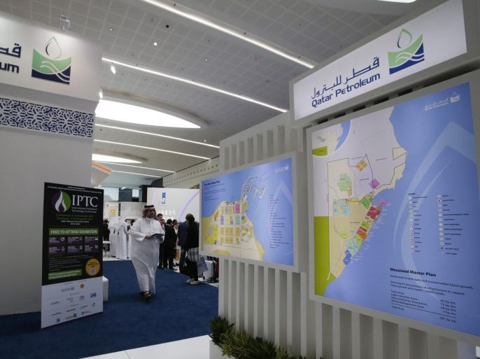 Visitors inspect Qatar Petroleum section at the exhibition of Abu Dhabi International Petroleum Exhibition and Conference (ADIPEC) in Abu Dhabi, United Arab Emirates, 09 November 2015. ADIPEC, a meeting place of the international oil and gas community, runs between 09 and 12 November 2015.