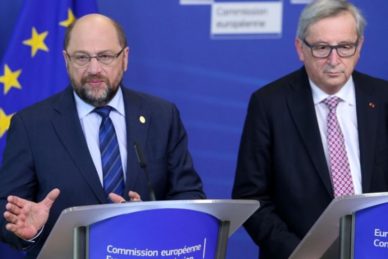 European Commission President Jean-Claude Juncker, right, and European Parliament President Martin Schultz participate in a media conference at EU headquarters in Brussels on Thursday, Feb. 18, 2016. European Union leaders are holding a summit in Brussels on Thursday and Friday to hammer out a deal designed to keep Britain in the 28-nation bloc. (AP Photo/Francois Walschaerts)