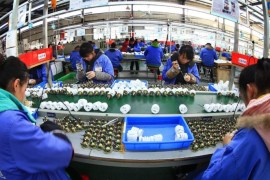 A photo made available 07 January 2016 of women working on the production line of energy-saving lamps in a factory in Suining in southwest China's Sichuan province, on 04 January 2016. China allowed the Chinsese official Renminbi currency to weaken further amid efforts to save its weak economic growth. EPA/ZHONG MIN CHINA OUT