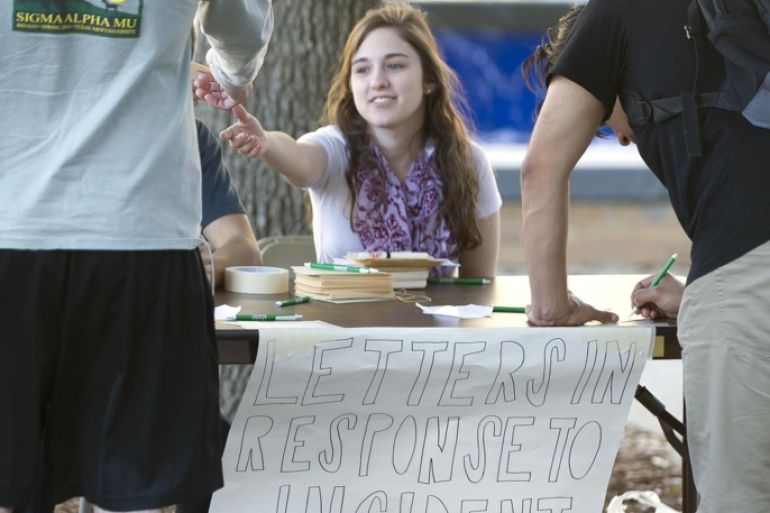 This Monday, Feb. 15, 2016, Texas A&amp;M student Hope Beitchman, a member of Texas A&amp;M Hillel, takes letters from students passing by her station set up for that purpose in Rudder Plaza in College Station, Texas. Texas A&amp;M University System Chancellor John Sharp apologized Tuesday to high school students for racial insults that some minority students say they heard while visiting the College Station campus last week. (Dave McDermand/College Station Eagle via AP) MANDATORY CREDIT